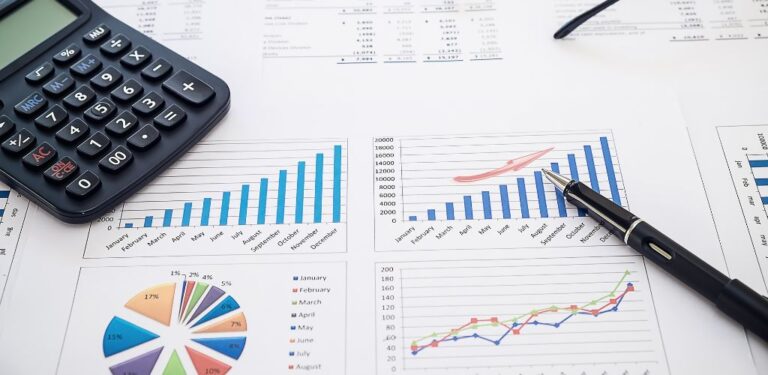 budget sheets on table with calculator